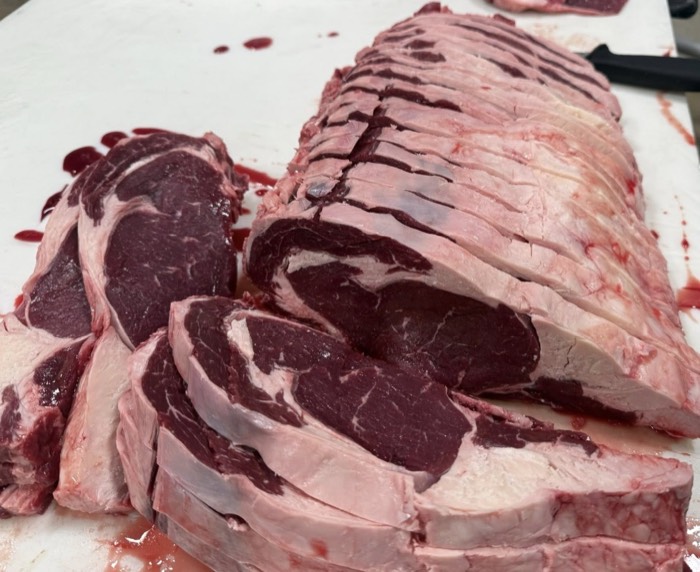 Breaking down a prime rib at The Meat Hook