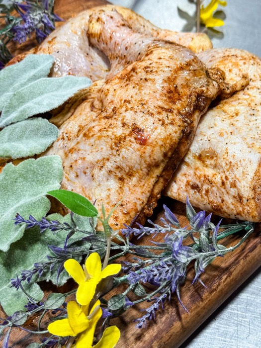 Seasoned chicken quarters at The Meat Hook